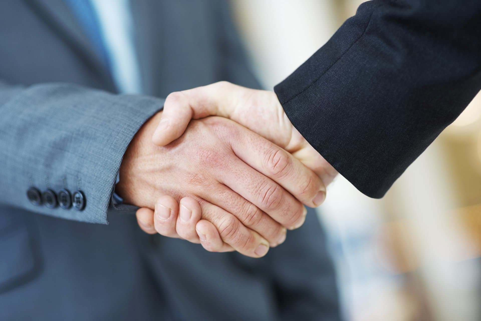 Close-up of a formal business handshake